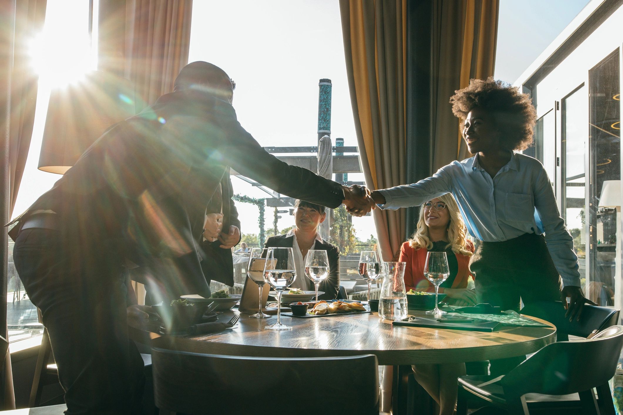 Business partnership meeting in hospitality setting